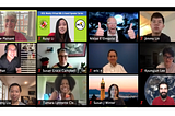 A picture of a Zoom meeting with numerous smiling members of the HCIL.