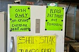 Signs on fridge in the diner