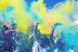 Photograph of people celebrating at a colourful event