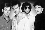 The Smiths in 1985 (Wikipedia/Paul Cox/Sire Records).