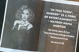 A printed piece of paper with a photo of Jinkx Monsoon on one side and white text on a black background on the other. The text reads: “In this town*, murder** is a form of entertainment***” -Matron Mama Morton (*New York City, January 28, 8pm **Seeing Jinkx Monsoon in Chicago on Broadway ***Christmas present for you)