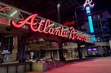 Photo depicting Atlanta Braves home stadium Truist Park and The Battery at night