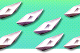 Seven paper boats on a teal surface with a halftone effect