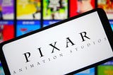 Tablet displaying Pixar Animation Studios over the backdrop of their movie covers