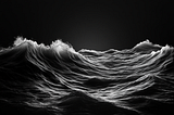 An black and white image of ocean waves.