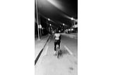 A blurry image of me riding a bike