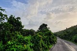 Open road, blue skies and the Western Ghats come alive in green