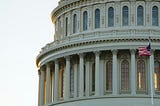 Capitol building with American flag