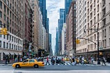 People crossing the street in a city