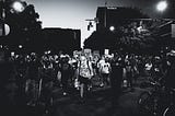 Black and white photo of a crowd at part of a peaceful racial justice protest.