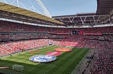 The scene at Wembley just before the teams emerged. The stadium is about three quarters full and the red carpet has been rolled out on the pitch along with two large Chelsea and Manchester United crests and the tournament sponsor’s logo.