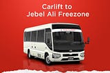 A white Toyota Coaster bus with the words “Carlift to Jebel Ali Freezone” written on the side. The bus is parked on a red background. There is also text on the side of the bus that says “Sans Transport”, “Private Passengers Transport” and “Call Now 050–8848270”.