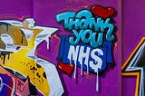 Photograph of a wall of graffiti that reads ‘Thank-you NHS’