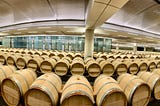 Wine barrels lined up in a row