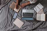 A person writing on a book.