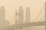 Gwangan Bridge and the city, a landmark in Busan, South Korea, are covered with contaminated yellow dust