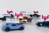 Uber and Lyft toy cars in a traffic jam