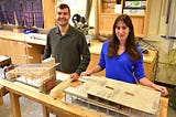 man and woman in wood-working shop