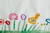 A child’s painting of flowers in various colours