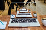 Image of a laptop with the image of the laptop repeated infinitely.