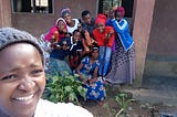A group of young African women smiling