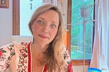 author blonde hair and red dress