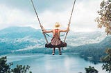 girl swinging on a swing