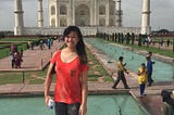 woman standing in front of taj mahal