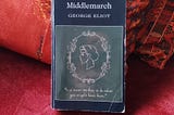 A photograph of a copy of ‘Middlemarch’ by George Eliot, propped against a cushion on a sofa. Image credit: Taryn Parker-Holmes (author)