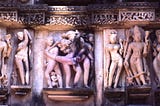 Sculptures in Lakshmana Temple showing gods and a couple practicing maithuna sex.