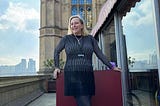 Middle Aged Female Standing in Front of The House of Lords by The Thames