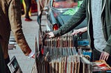 Few racks of records on street fair