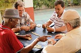 Retirees play dominoes together