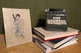 Princess Leia Burlap painting next to a stack of books with a miniature typewriter on top