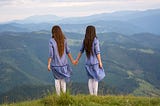 Two women looking over the mountains