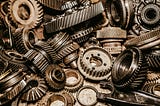 Photograph of many small gears in a pile