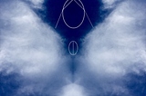 A photo of white clouds in the shape of wings in a dark blue sky. The face and praying hands of a woman have been added with thin lines.