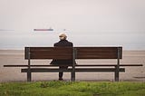Old man sitting on a bench