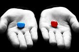 One hand holding a red pill, the other holding a blue pill—referencing the iconic scene from The Matrix.