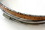 Spring closure on a vintage metal embroidery hoop