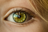 clock ticking inside a woman’s eye