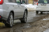 An image showing two cars on a road representing Vehicle Conditions for Accurate Appraisals