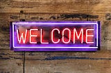 A neon welcome sign
