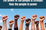Fists raised with the words “The power of the people is strong than the people in power” above them..