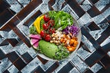 A colorful plate of food superimposed over a labyrinth