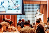 Zack Schuch leads business conference