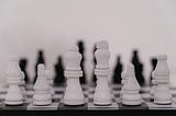 a black and white image of a unplayed chess board