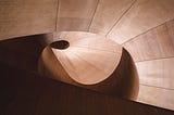 Abstract architectural image of modern spiral staircase.