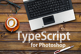 Stock photo of laptop on wood with the caption “TypeScript for Photoshop”