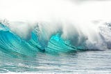 image of turquoise waves in the sea.
